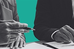 [ai] Two hands, one holding a pen and the other positioned over a document, with a turquoise background. The image captures a professional setting, possibly related to a meeting or signing of a agreement.